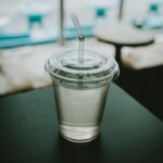 여성 건강관리, 작은 실천이 만드는 큰 변화 clear plastic disposable cup on top of black surface