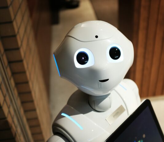 “AI가 알려주는 건강 관리, 우리 일상에 스며들다” white robot near brown wall