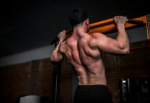 근육, 더 이상 운동선수만의 전유물 아니다…일상 속 근육 관리법 주목 topless man in black shorts holding orange bar