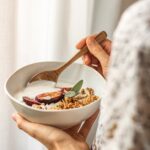 “마음 건강도 생활 습관에서 시작… 일상 루틴 속 마음 챙김법 주목” person holding white ceramic bowl with food