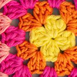 ‘마음도 매일 돌봄’: 정신건강 지키는 실천 루틴 주목받아 Vibrant crochet granny square pattern in yellow, orange, and pink.