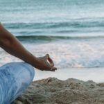 일상 속 ‘마음 챙김’ 실천… 번아웃 예방하는 소소한 루틴 인기 person in blue shorts sitting on beach shore during daytime
